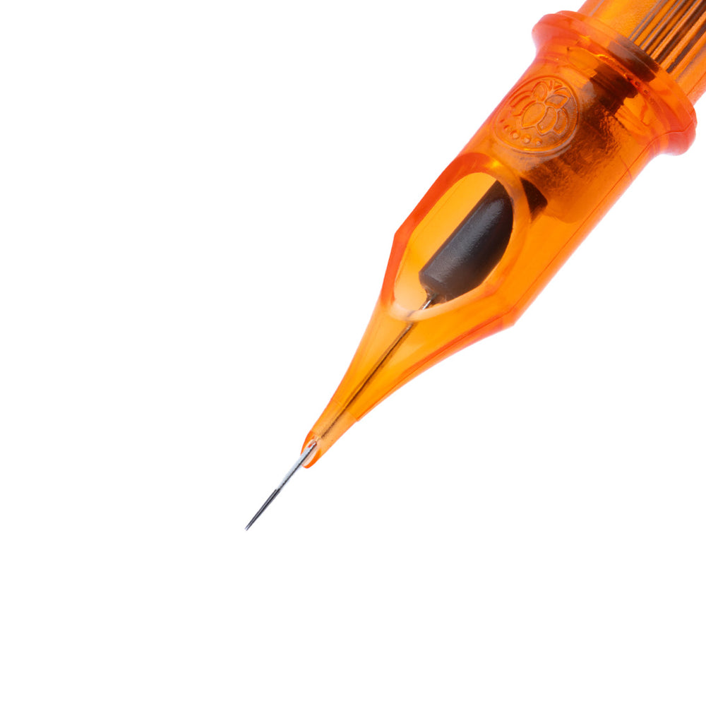 Close-up of an orange tattoo needle cartridge on a white background