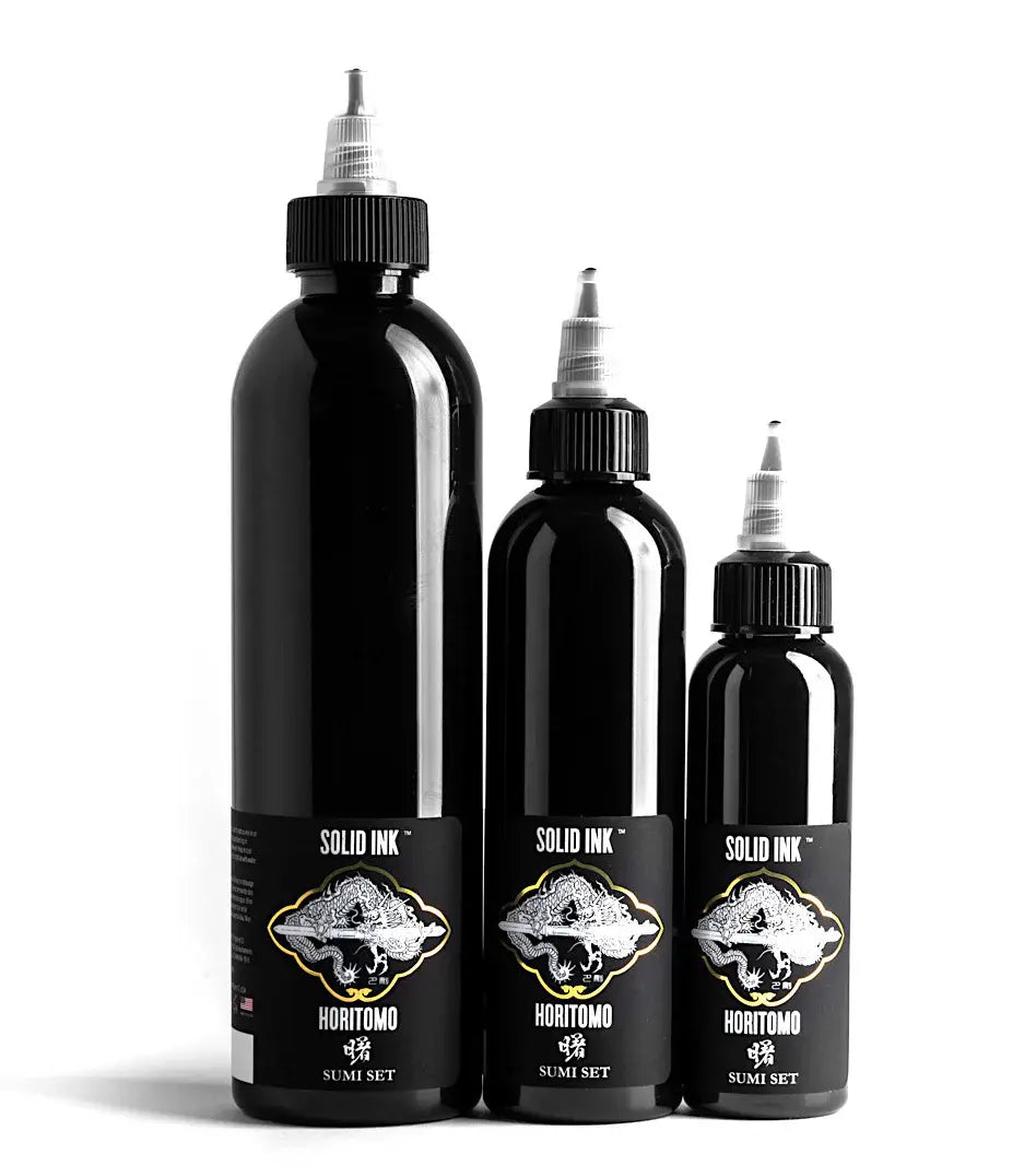 Three black bottles of Solid Ink Horitomo Sumi Set on a white background