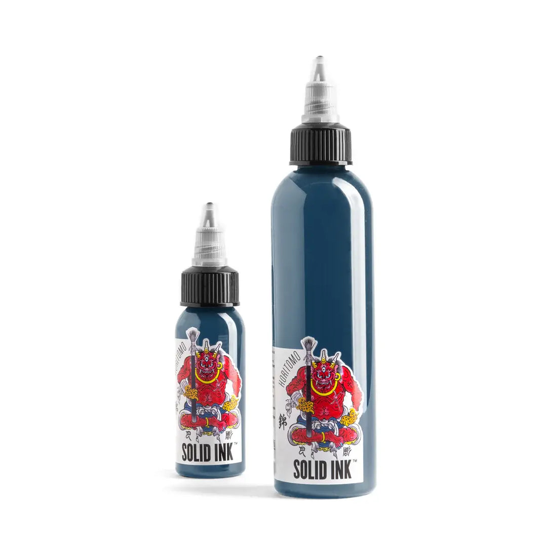 Two bottles of Solid Ink tattoo ink on a white background